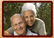 Older couple with great smiles who are happy with their dental work